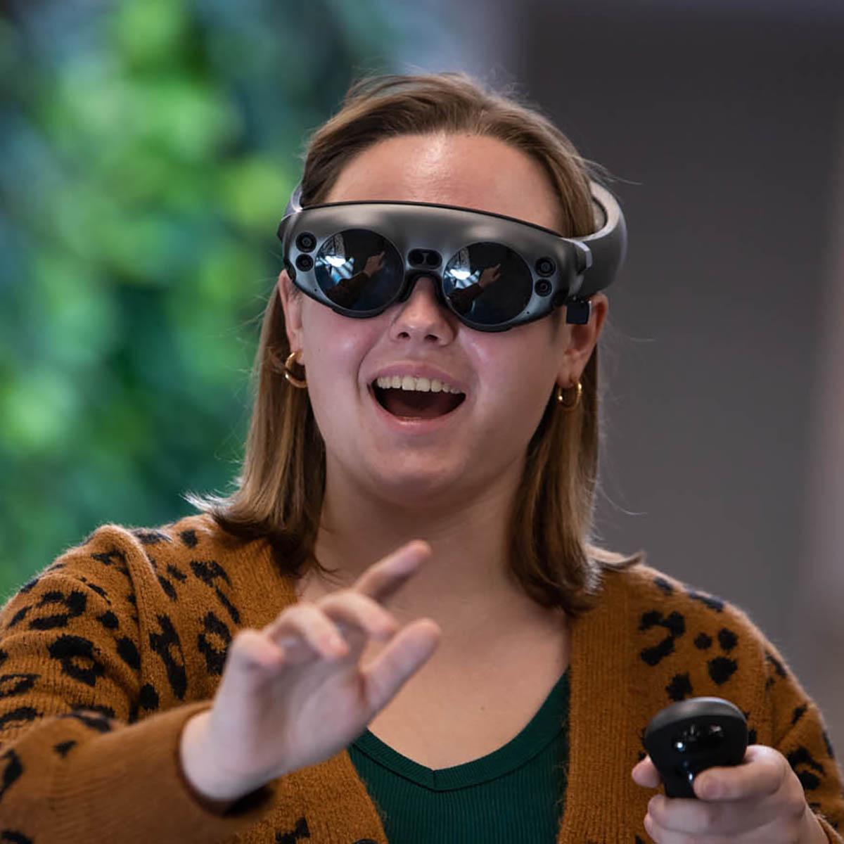 Photo of a student in virtual reality goggles